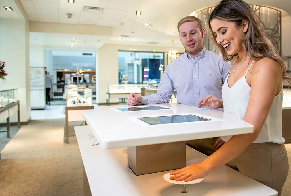 woman cleaning countertops in jewelry store